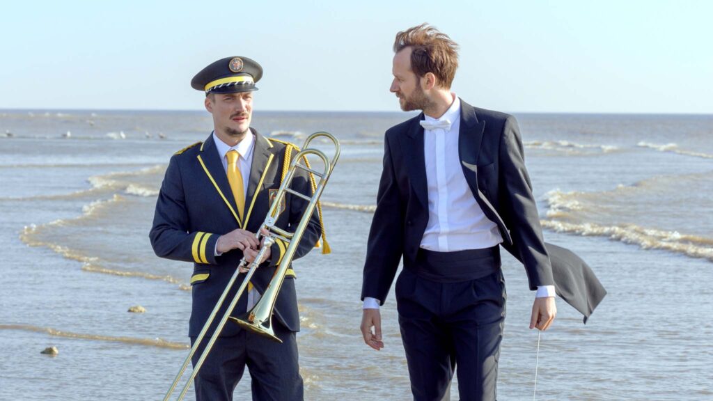 Benjamin Lavernhe as Thibaut Desormeaux and Pierre Lottin as Jimmy Lecocq in The Marching Band, directed by Emmanuel Courcol. Photo: Thibault Grabherr. Copyright: Vertigo Releasing. All Rights Reserved.