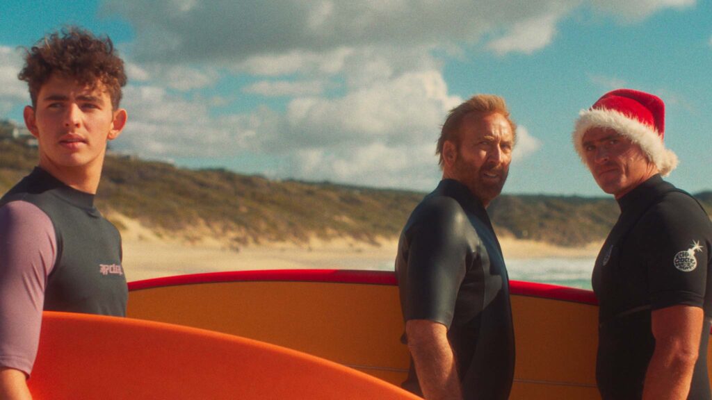 Finn Little as The Kid, Nicolas Cage as The Surfer and Alexander Bertrand as Pitbull in The Surfer, directed by Lorcan Finnegan. Copyright: Vertigo Releasing. All Rights Reserved.