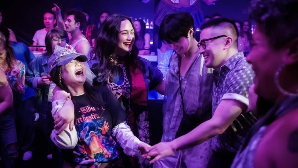 Kelly Marie Tran as Angela Chen, Lily Gladstone as Lee, Han Gi-chan as Min and Bowen Yang as Chris in The Wedding Banquet, directed by Andrew Ahn. Photo: Luka Cyprian. Copyright: Bleecker Street. All Rights Reserved.