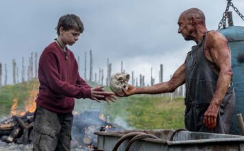 Alfie Williams as Spike and Ralph Fiennes as Dr Kelson in 28 Years Later, directed by Danny Boyle. Photo: Miya Mizuno. Copyright: 2025 CTMG, Inc. All Rights Reserved.