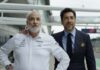 Kim Bodnia as Kaspar and Javier Bardem as Ruben Cervantes in F1: The Movie, directed by Joseph Kosinski. Copyright: Warner Bros. Entertainment Inc./Apple Original Films. All Rights Reserved.