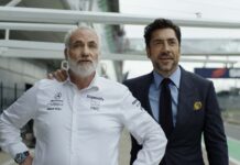 Kim Bodnia as Kaspar and Javier Bardem as Ruben Cervantes in F1: The Movie, directed by Joseph Kosinski. Copyright: Warner Bros. Entertainment Inc./Apple Original Films. All Rights Reserved.