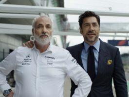 Kim Bodnia as Kaspar and Javier Bardem as Ruben Cervantes in F1: The Movie, directed by Joseph Kosinski. Copyright: Warner Bros. Entertainment Inc./Apple Original Films. All Rights Reserved.