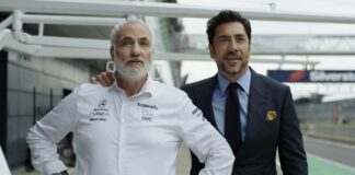 Kim Bodnia as Kaspar and Javier Bardem as Ruben Cervantes in F1: The Movie, directed by Joseph Kosinski. Copyright: Warner Bros. Entertainment Inc./Apple Original Films. All Rights Reserved.