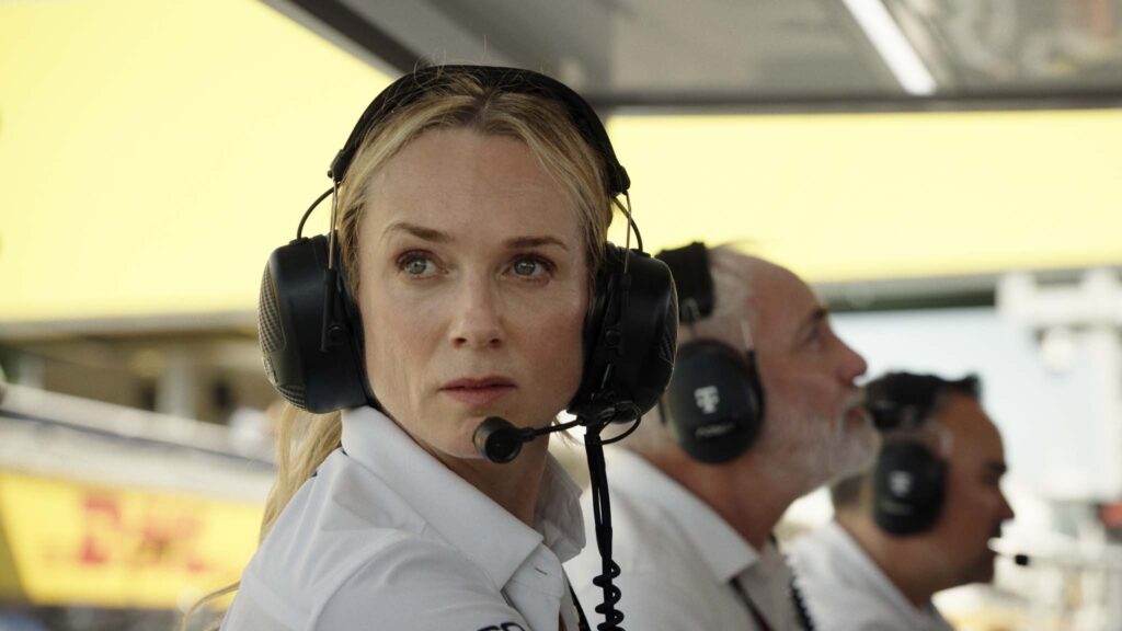 Kerry Condon as Kate and Kim Bodnia as Kaspar in F1: The Movie, directed by Joseph Kosinski. Copyright: Warner Bros. Entertainment Inc./Apple Original Films. All Rights Reserved.