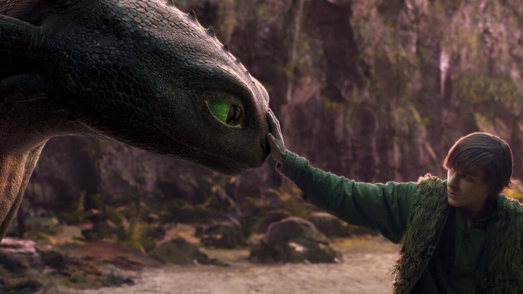 Mason Thames as Hiccup with his Night Fury dragon, Toothless, in How To Train Your Dragon, directed by Dean DeBlois. Copyright: Universal Studios. All Rights Reserved.
