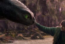 Mason Thames as Hiccup with his Night Fury dragon, Toothless, in How To Train Your Dragon, directed by Dean DeBlois. Copyright: Universal Studios. All Rights Reserved.