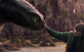 Mason Thames as Hiccup with his Night Fury dragon, Toothless, in How To Train Your Dragon, directed by Dean DeBlois. Copyright: Universal Studios. All Rights Reserved.