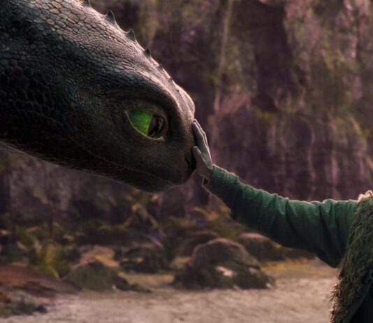 Mason Thames as Hiccup with his Night Fury dragon, Toothless, in How To Train Your Dragon, directed by Dean DeBlois. Copyright: Universal Studios. All Rights Reserved.