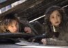 Mason Thames as Hiccup and Nico Parker as Astrid in How To Train Your Dragon, directed by Dean DeBlois. Photo: Helen Sloan. Copyright: Universal Studios. All Rights Reserved.