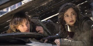 Mason Thames as Hiccup and Nico Parker as Astrid in How To Train Your Dragon, directed by Dean DeBlois. Photo: Helen Sloan. Copyright: Universal Studios. All Rights Reserved.