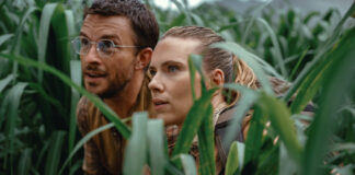 Jonathan Bailey as paleontologist Dr Henry Loomis and Scarlett Johansson as skilled covert operations expert Zora Bennett in Jurassic World Rebirth, directed by Gareth Edwards. Photo: Jasin Boland. Copyright: Universal Pictures and Amblin Entertainment. All Rights Reserved.