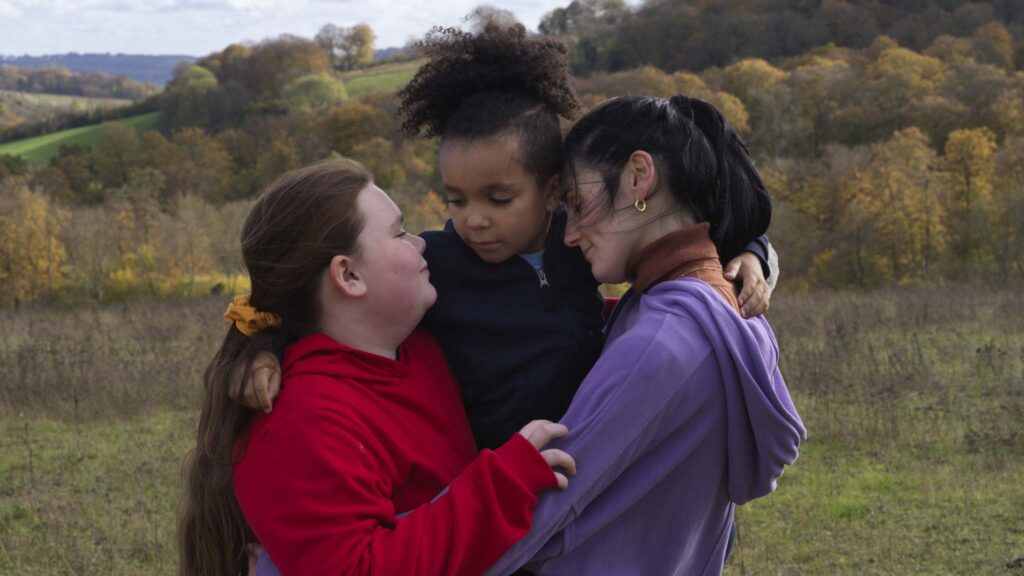 Tegan-Mia Stanley Rhoads as Ava, Luke Howitt as Leo and Posy Sterling as Molly Brown in Lollipop, directed by Daisy-May Hudson. Photo: Tereza Cervenova. Copyright: MetFilm Distribution. All Rights Reserved.