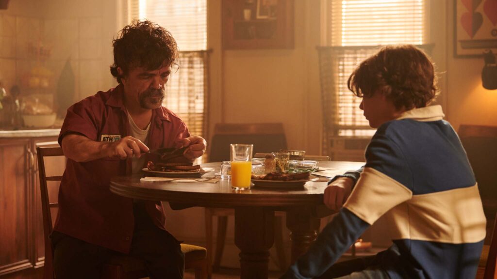 Peter Dinklage as Winston and Jacob Tremblay as Wade in The Toxic Avenger Uncut, directed by Macon Blair. Photo: Yana Blajeva. Copyright: Legendary/Signature Entertainment. All Rights Reserved.