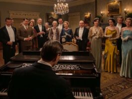 Allen Leech as Tom Branson, Dominic West as Guy Dexter, Robert James-Collier as Thomas Barrow, Douglas Reith as Lord Merton, Sarah Crowden as Lady Manville, Penelope Wilton as Isobel Merton, Paul Giamatti as Harold Levinson, Elizabeth McGovern as Cora Grantham, Michelle Dockery as Lady Mary, Hugh Bonneville as Robert Grantham, Laura Carmichael as Lady Edith and Harry Hadden-Paton as Bertie Hexham in Downton Abbey: The Grand Finale, directed by Simon Curtis. Photo: Rory Mulvey. Copyright: Focus Features LLC. All Rights Reserved.