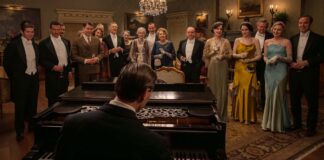 Allen Leech as Tom Branson, Dominic West as Guy Dexter, Robert James-Collier as Thomas Barrow, Douglas Reith as Lord Merton, Sarah Crowden as Lady Manville, Penelope Wilton as Isobel Merton, Paul Giamatti as Harold Levinson, Elizabeth McGovern as Cora Grantham, Michelle Dockery as Lady Mary, Hugh Bonneville as Robert Grantham, Laura Carmichael as Lady Edith and Harry Hadden-Paton as Bertie Hexham in Downton Abbey: The Grand Finale, directed by Simon Curtis. Photo: Rory Mulvey. Copyright: Focus Features LLC. All Rights Reserved.