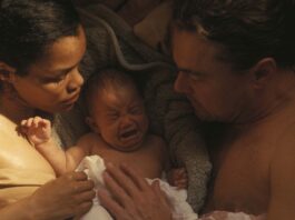 Teyana Taylor as Perfidia And Leonardo DiCaprio as Bob Ferguson in One Battle After Another, directed by Paul Thomas Anderson. Copyright: Warner Bros. Pictures. All Rights Reserved.