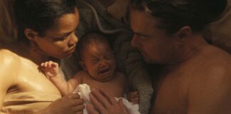 Teyana Taylor as Perfidia And Leonardo DiCaprio as Bob Ferguson in One Battle After Another, directed by Paul Thomas Anderson. Copyright: Warner Bros. Pictures. All Rights Reserved.