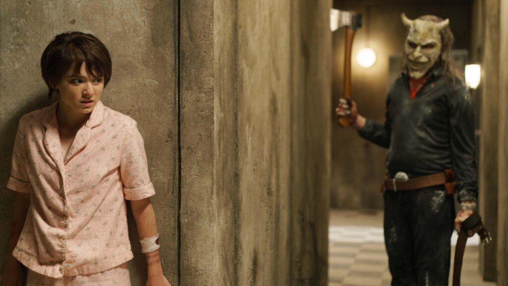 Madeleine McGraw as Gwen and Ethan Hawke as The Grabber in Black Phone 2, directed by Scott Derrickson. Photo: Sabrina Lantos. Copyright: Universal Pictures/Blumhouse. All Rights Reserved.