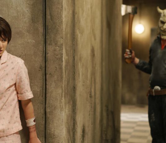 Madeleine McGraw as Gwen and Ethan Hawke as The Grabber in Black Phone 2, directed by Scott Derrickson. Photo: Sabrina Lantos. Copyright: Universal Pictures/Blumhouse. All Rights Reserved.