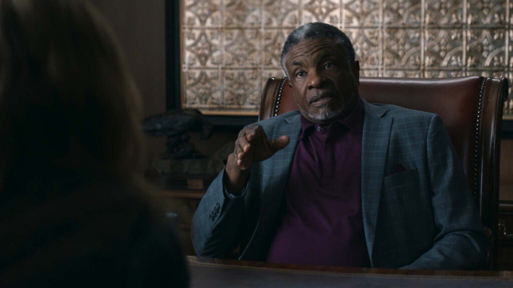 Camille Sullivan as Mia and Keith David as Morton Jacobson in Shelby Oaks, directed by Chris Stuckmann. Copyright: Altitude Film Distribution. All Rights Reserved.