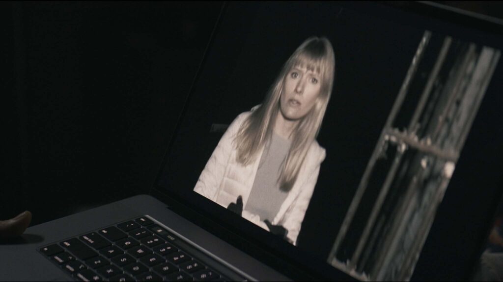 Sarah Durn as Riley in Shelby Oaks, directed by Chris Stuckmann. Copyright: Altitude Film Distribution. All Rights Reserved.