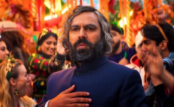 Film Review of the Week 11 November 2025 Kunal Nayyar as Eshaan Sood in Christmas Karma, directed by Gurinder Chadha. Copyright: True Brit. All Rights Reserved.