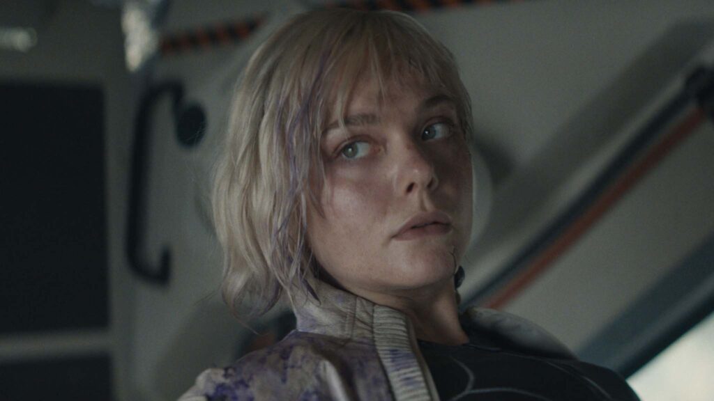 Elle Fanning as Thia in Predator: Badlands, directed by Dan Trachtenberg. Copyright: 20th Century Studios. All Rights Reserved.