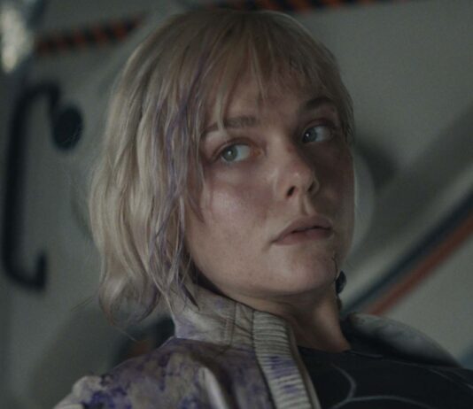 Elle Fanning as Thia in Predator: Badlands, directed by Dan Trachtenberg. Copyright: 20th Century Studios. All Rights Reserved.