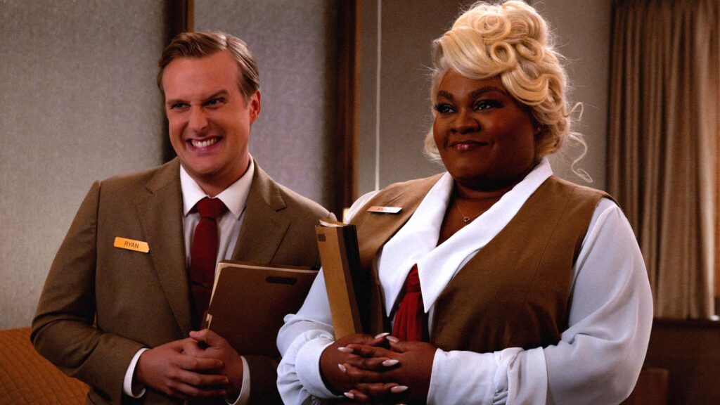 John Early as Ryan and Da’Vine Joy Randolph as Anna in Eternity, directed by David Freyne. Photo: Leah Gallo. Copyright: A24. All Rights Reserved.