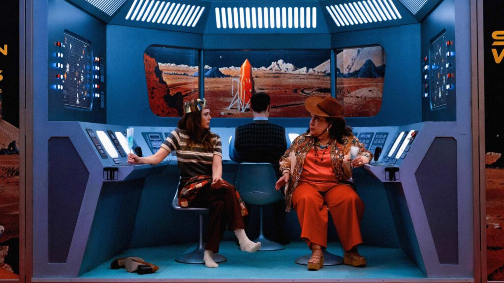 Elizabeth Olsen as Joan and Olga Merediz as Karen in Eternity, directed by David Freyne. Photo: Leah Gallo. Copyright: A24. All Rights Reserved.