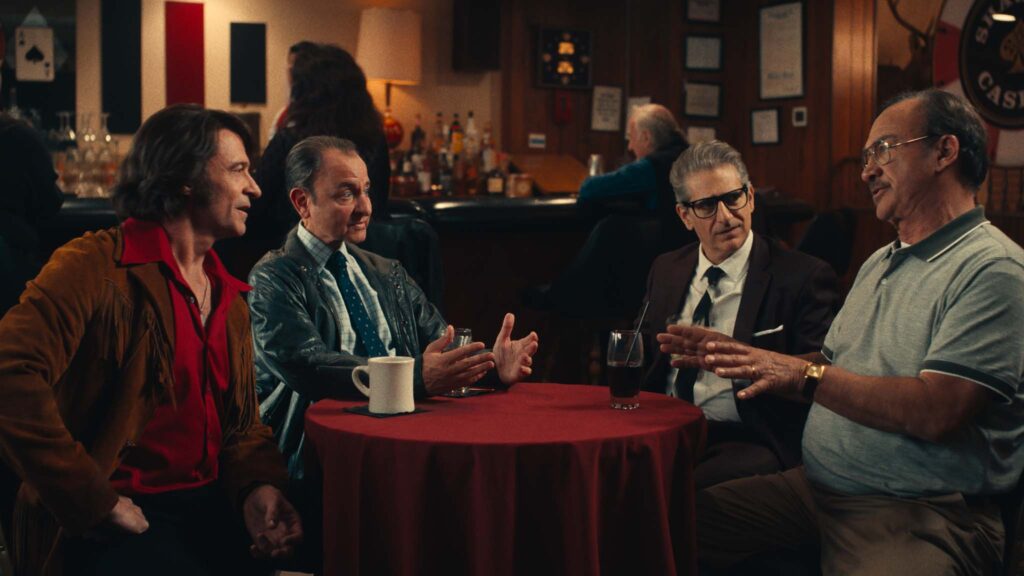 Hugh Jackman as Mike Sardina, Fisher Stevens as Dr. Dave Watson, Michael Imperioli as Mark Shurilla and Jim Belushi as Tom D'Amato in Song Sung Blue, directed by Craig Brewer. Copyright: Focus Features, LLC. All Rights Reserved.