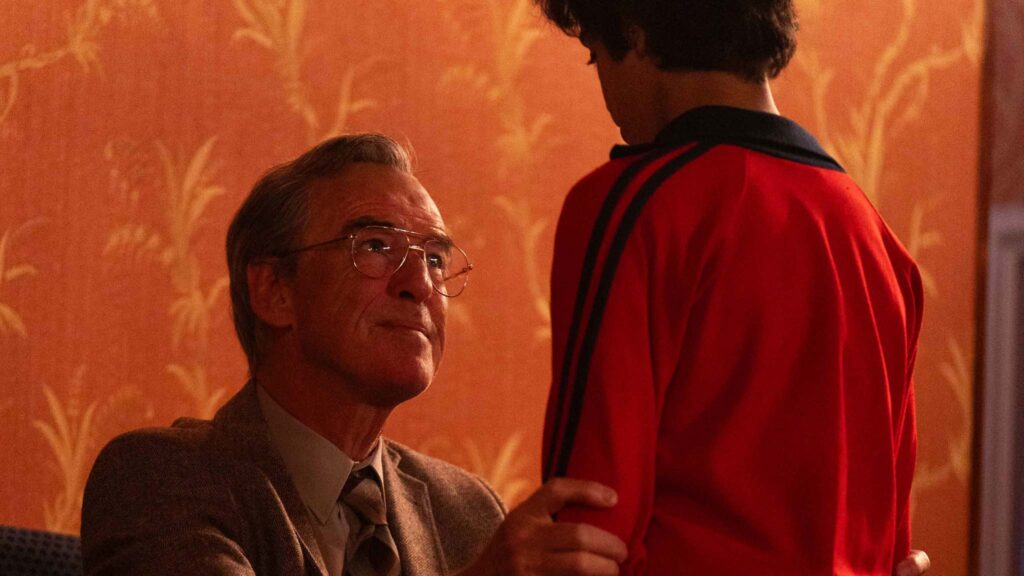 Pierce Brosnan as Brendan Ingle and Ghaith Saleh as young Naseem Hamed in Giant, directed by Rowan Athale. Photo: Sam Taylor. Copyright: True Brit. All Rights Reserved.