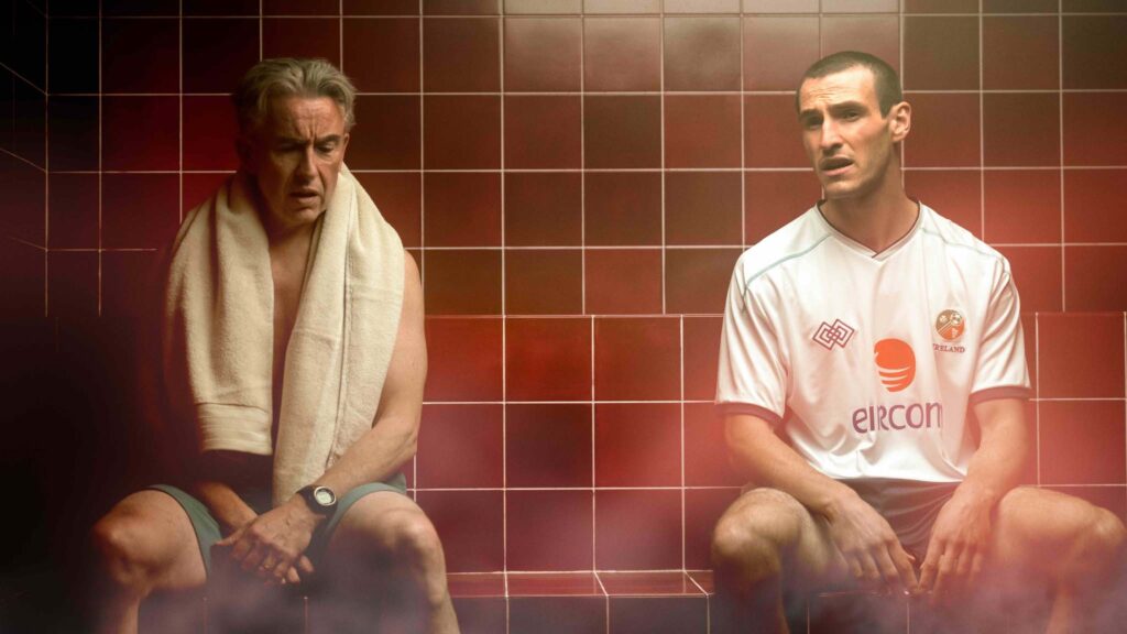 Steve Coogan as Mick McCarthy and Eanna Hardwicke as Roy Keane in Saipan, directed by Lisa Barros D'Sa and Glenn Leyburn. Photo: Aidan Monaghan. Copyright: Vertigo Releasing/Wildcard Distribution. All Rights Reserved.