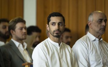 Joe Alwyn as Laertes, Riz Ahmed as Prince Hamlet and Art Malik as Claudius in Hamlet, directed by Aneil Karia. Copyright: Universal Studios. All Rights Reserved.