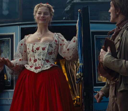 Martin Clunes as Mr Earnshaw, Margot Robbie as Catherine Earnshaw and Ewan Mitchell as Joseph in Wuthering Heights, directed by Emerald Fennell. Copyright: Warner Bros. Entertainment. All Rights Reserved.