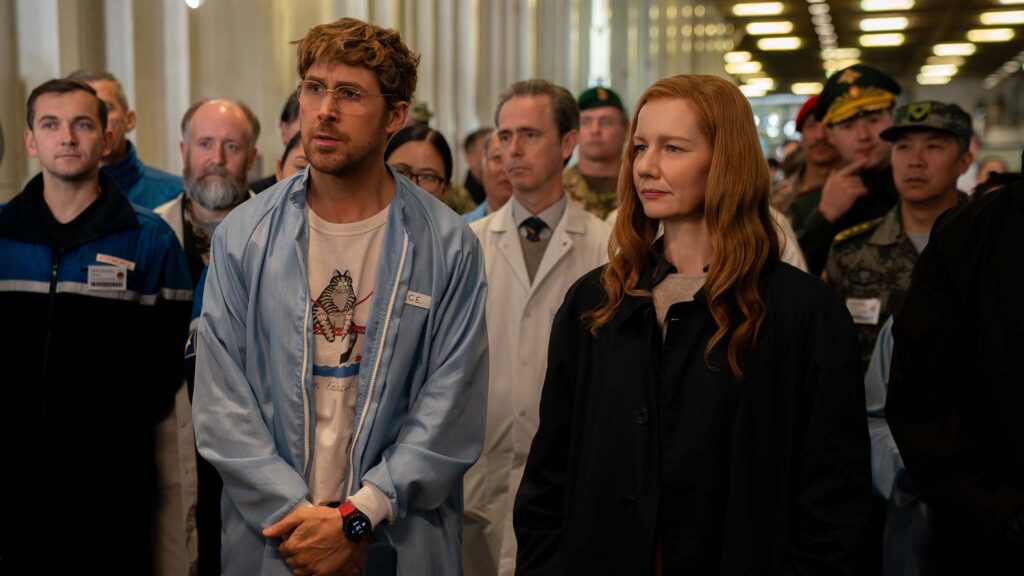 Ryan Gosling as Ryland Grace and Sandra Hüller as Eva Stratt in Project Hail Mary, directed by Phil Lord and Christopher Miller. Photo: Jonathan Olley. Copyright: Amazon Content Services LLC. All Rights Reserved.