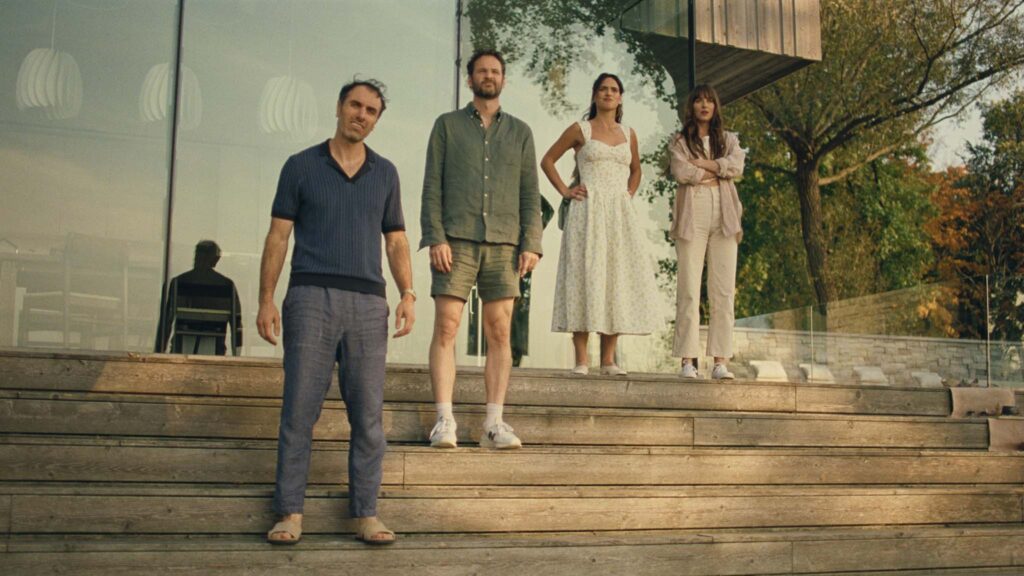 Michael Angelo Covino as Paul, Kyle Marvin as Carey, Adria Arjona as Ashley and Dakota Johnson as Julie in Splitsville, directed by Michael Angelo Covino. Copyright: Universal Pictures. All Rights Reserved.