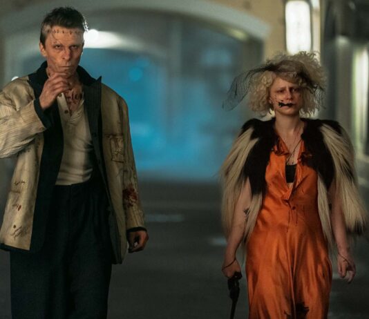 Christian Bale as Frank and Jessie Buckley as The Bride in The Bride!, directed by Maggie Gyllenhaal. Photo: Niko Tavernise. Copyright: Warner Bros. Entertainment Inc.. All Rights Reserved.