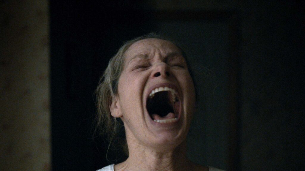 Michele Duquet as Mama in Undertone, directed by Ian Tuason. Copyright: A24. All Rights Reserved.