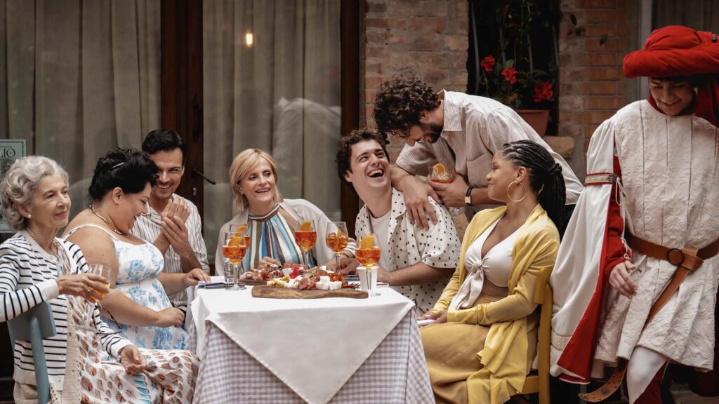 Stefania Casini as Nonna Alessia, Stella Pecollo as Francesca, Luca Setaccioli as Leo, Isabella Ferrari as Gabriella, Tommaso Cassissa as Enzo, Lorenzo de Moor as Matteo and Halle Bailey as Anna in You, Me & Tuscany, directed by Kat Coiro. Photo: Giulia Parmigiani. Copyright: Universal Studios. All Rights Reserved.