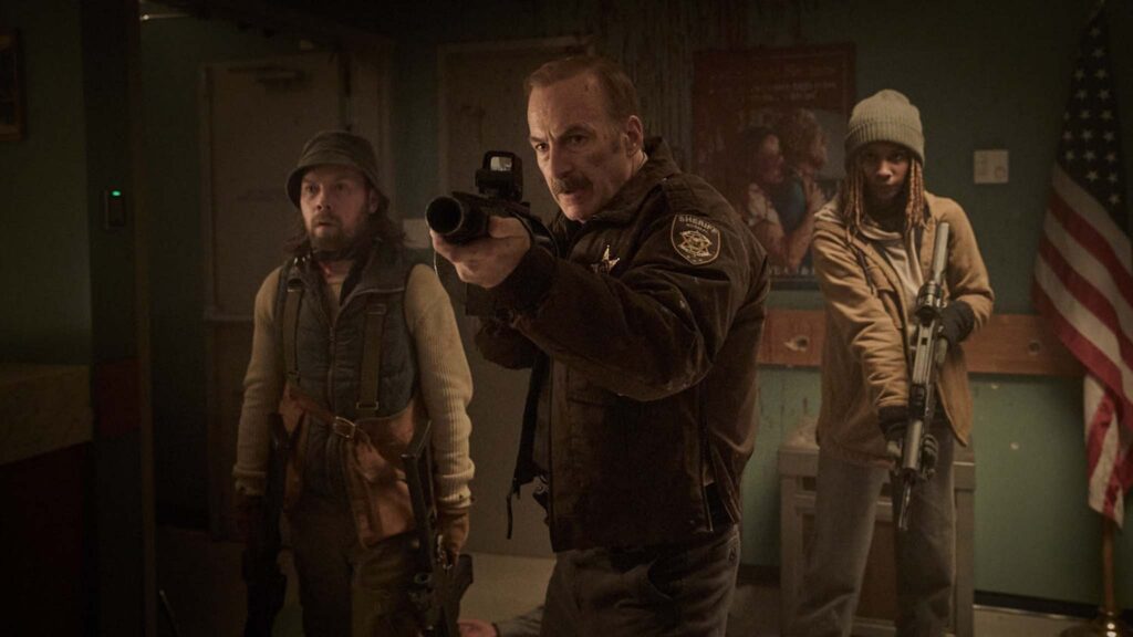 Bob Odenkirk as Ulysses Richardson and Brendan Fletcher as Keith, Bob Odenkirk as Ulysses Richardson and Reena Jolly as Lori in Normal, directed by Ben Wheatley. Copyright: Magnolia Films. All Rights Reserved.