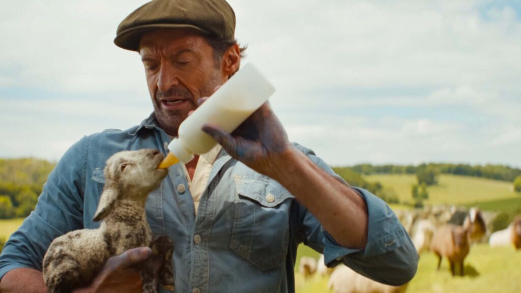 Tommy Birchall as the voice of The Winter Lamb and Hugh Jackman as George Hardy in The Sheep Detectives, directed by Kyle Balda. Copyright: Amazon Content Services LLC. All Rights Reserved.