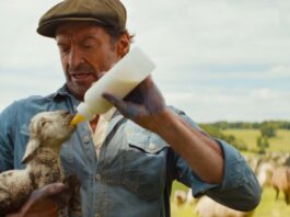 Tommy Birchall as the voice of The Winter Lamb and Hugh Jackman as George Hardy in The Sheep Detectives, directed by Kyle Balda. Copyright: Amazon Content Services LLC. All Rights Reserved.