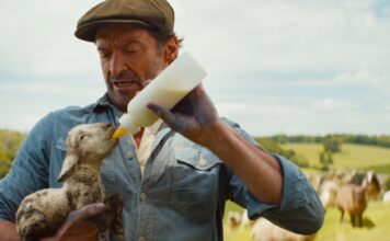 Tommy Birchall as the voice of The Winter Lamb and Hugh Jackman as George Hardy in The Sheep Detectives, directed by Kyle Balda. Copyright: Amazon Content Services LLC. All Rights Reserved.