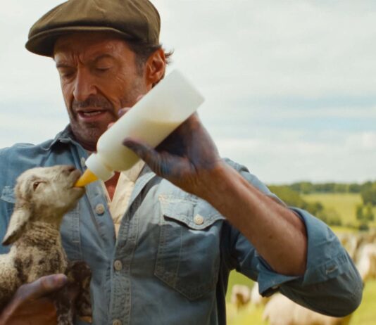 Tommy Birchall as the voice of The Winter Lamb and Hugh Jackman as George Hardy in The Sheep Detectives, directed by Kyle Balda. Copyright: Amazon Content Services LLC. All Rights Reserved.