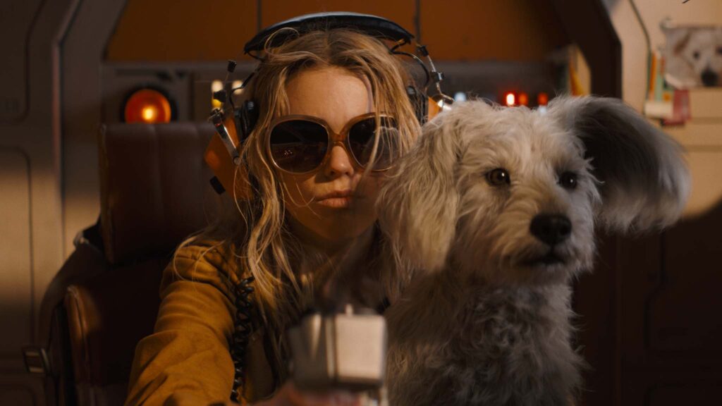 Milly Alcock as Supergirl and Krypto in Supergirl. , directed by Craig Gillespie. Copyright: Warner Bros. Entertainment. All Rights Reserved.