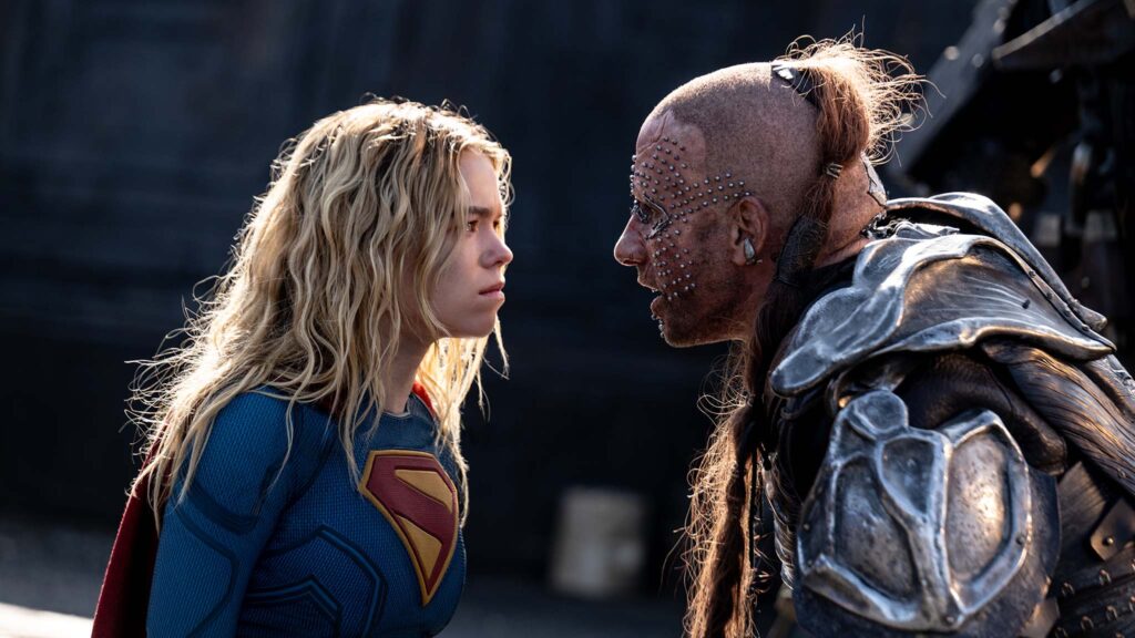 Milly Alcock as Supergirl and Matthias Schoenaerts as Krem in Supergirl, directed by Craig Gillespie. Photo: Parisa Taghizadeh. Copyright: 2026 Warner Bros. Entertainment. All Rights Reserved. TM & Copyright DC
