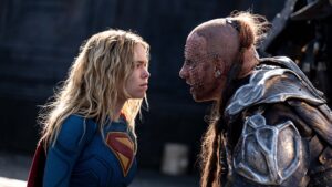 Milly Alcock as Supergirl and Matthias Schoenaerts as Krem in Supergirl, directed by Craig Gillespie. Photo: Parisa Taghizadeh. Copyright: 2026 Warner Bros. Entertainment. All Rights Reserved. TM & Copyright DC