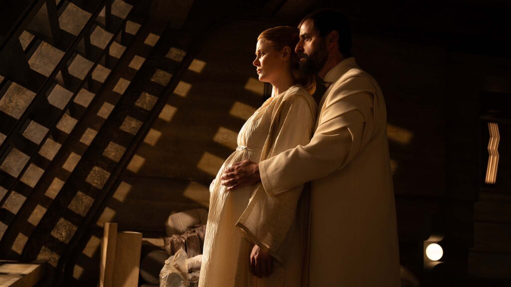 Emily Beecham as Alura Zor-El and David Krumholtz as Zor-El in Supergirl, directed by Craig Gillespie. Photo: Parisa Taghizadeh. Copyright: Warner Bros. Entertainment. All Rights Reserved.